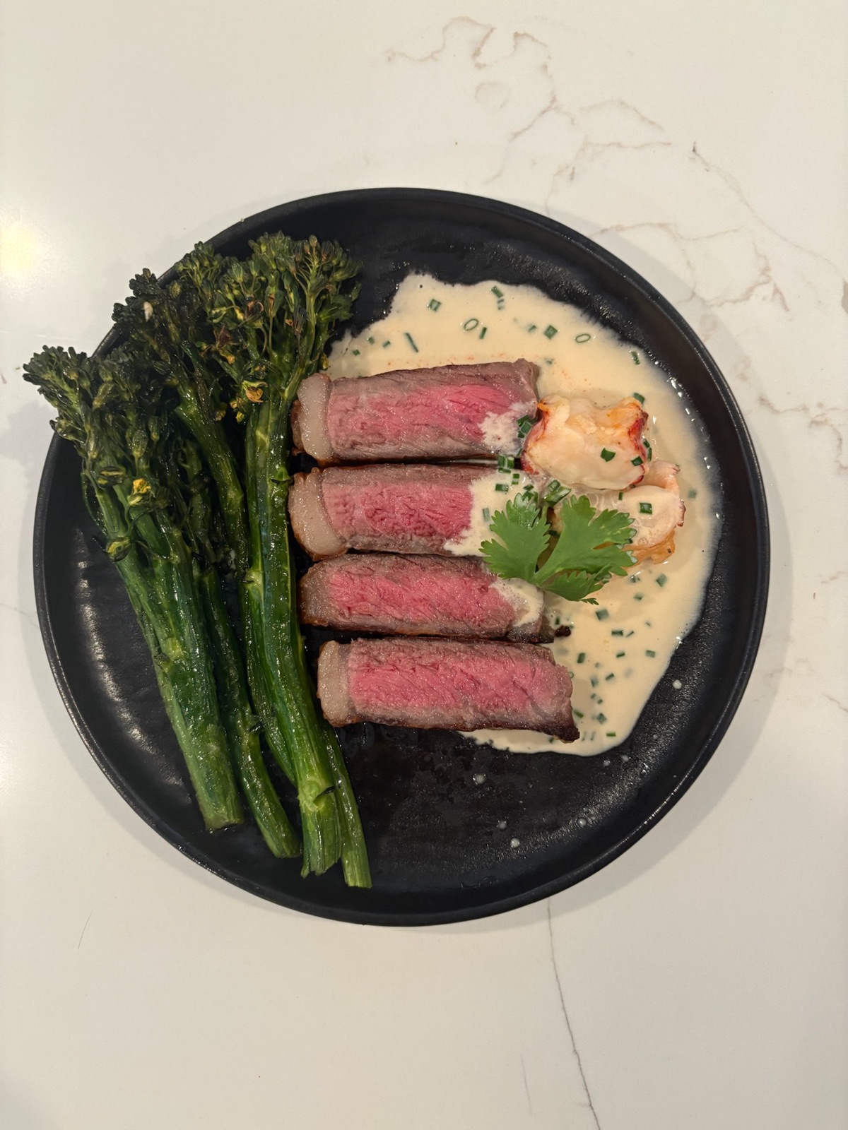 Steak and lobster with charred broccolini